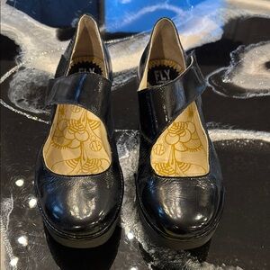 Fly London Black Heels with Chunky Platform and Gold Accents